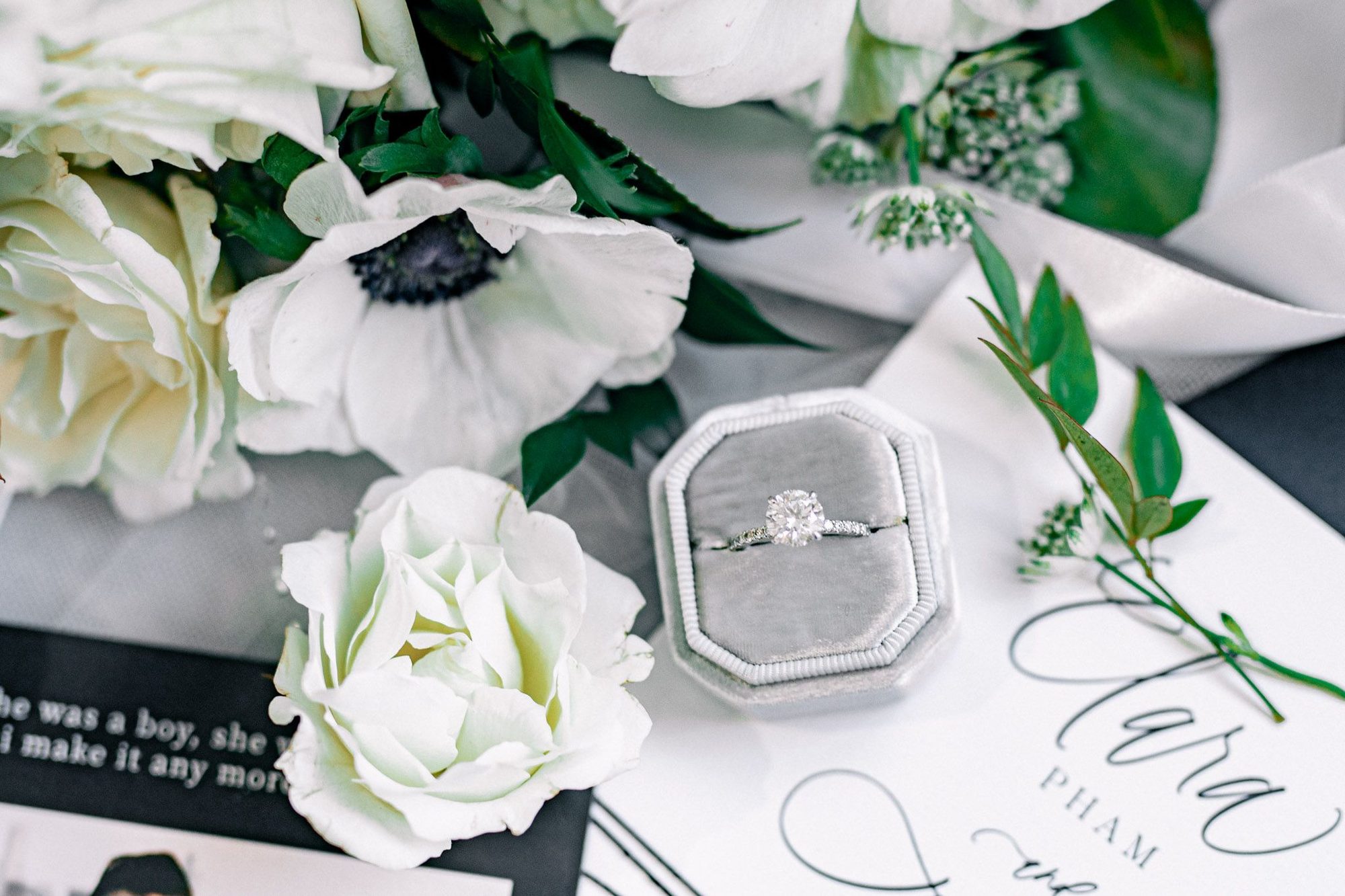 Ring box and white flowers flat lay