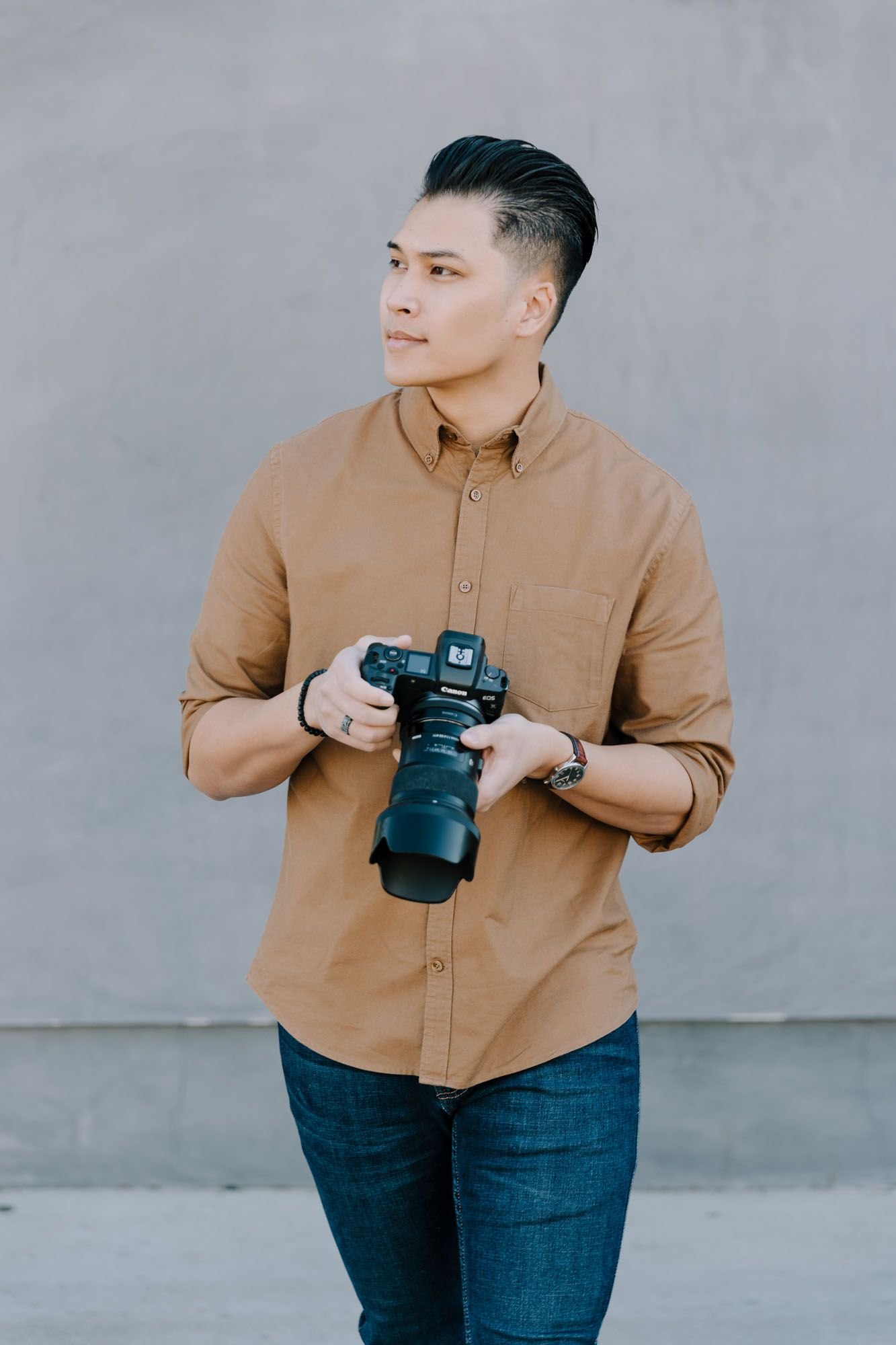 Kevin Tran holding his camera