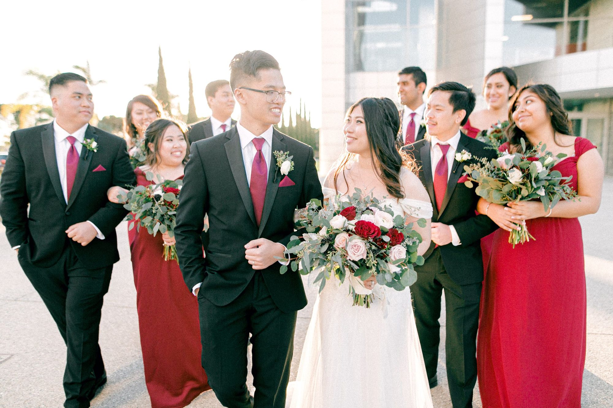 Couple with their bridal party in red