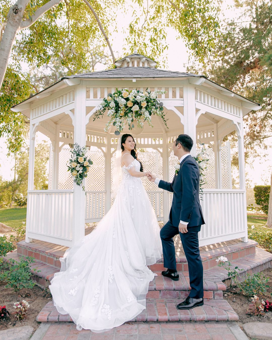 Couple under a white gazebo